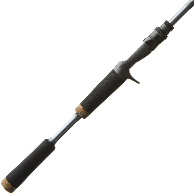 A close-up of a black fishing rod handle with foam grips and cork ends, showing a trigger grip reel seat designed for baitcasting reels.