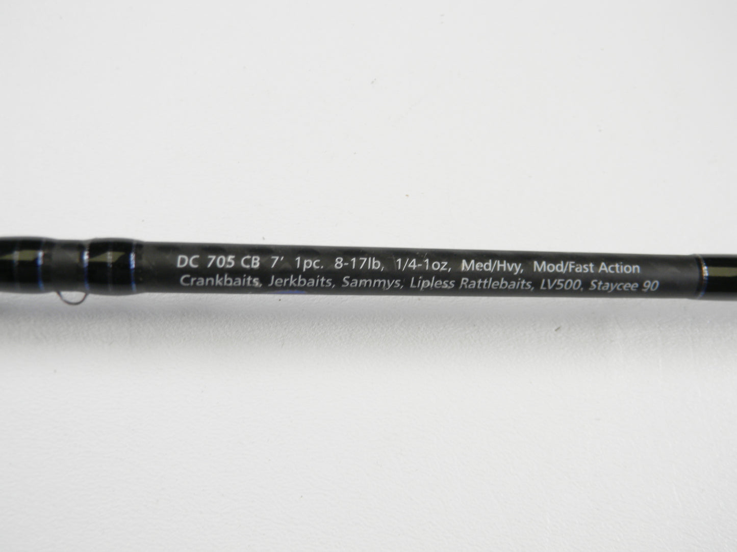 Close-up of a Dobyns Champion XP DC705CB 7'0" Med Hvy Used Casting Rod in excellent condition. Specs: 8-17lb, 1/4-1oz, Mod/Fast action. Great for crankbaits and jerkbaits. Trade in your used rod for store credit!.