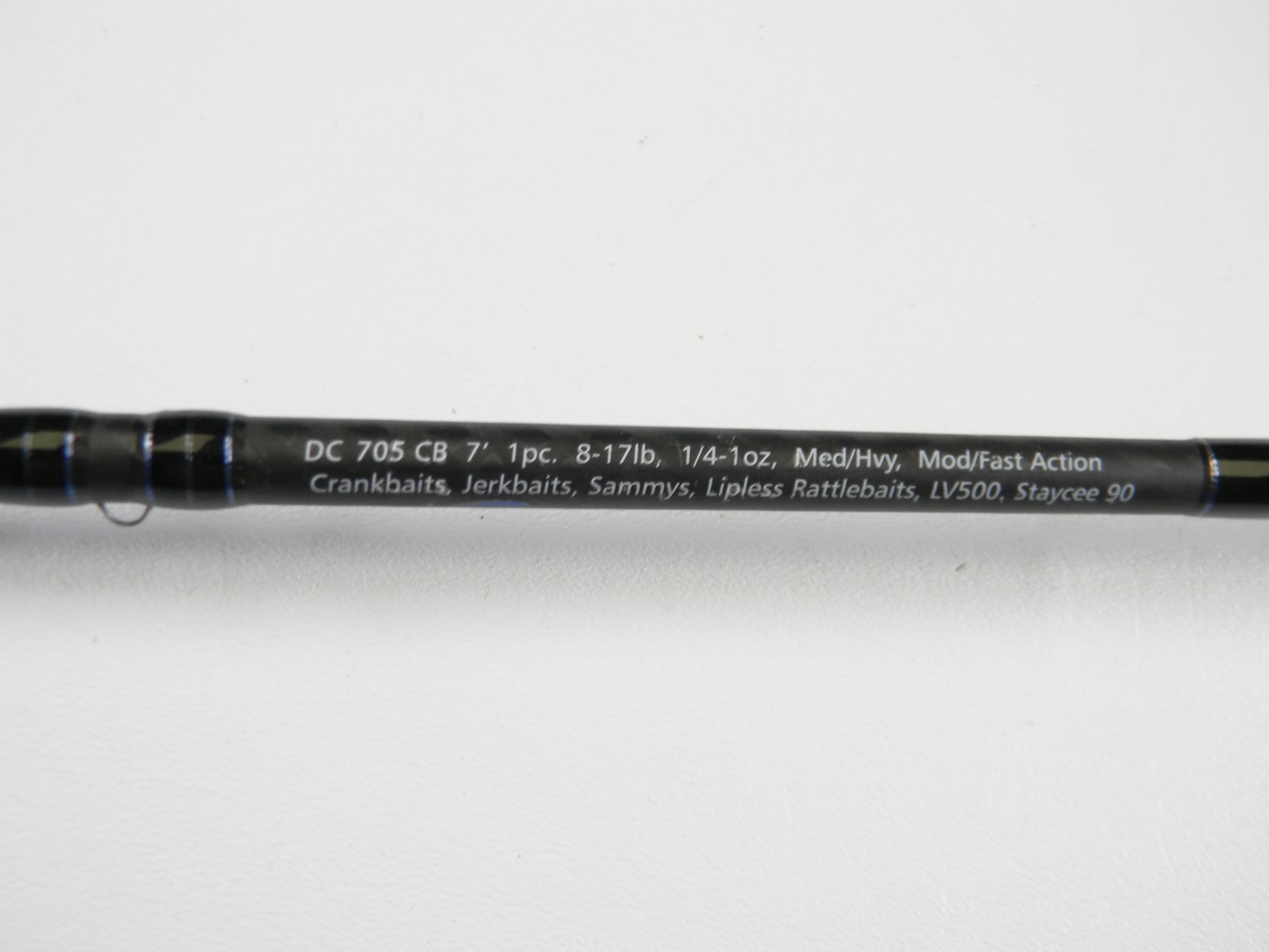 Close-up of a Dobyns Champion XP DC705CB 7'0" Med Hvy Used Casting Rod in excellent condition. Specs: 8-17lb, 1/4-1oz, Mod/Fast action. Great for crankbaits and jerkbaits. Trade in your used rod for store credit!.
