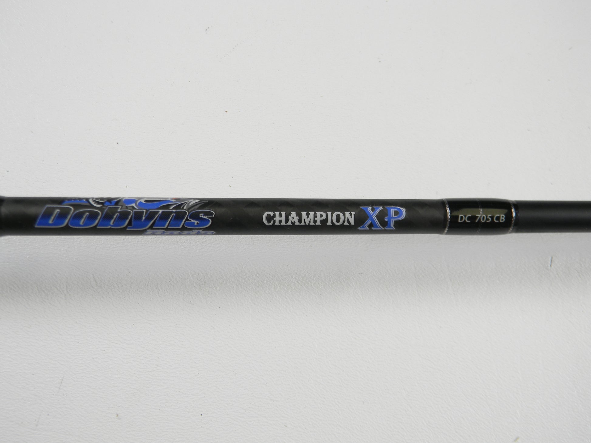 A close-up of the Dobyns Champion XP DC705CB 7'0" Medium Heavy Used Casting Rod in excellent condition—ideal for upgrading through our Rod and Reel Trade-In Program or earning store credit with your used gear.