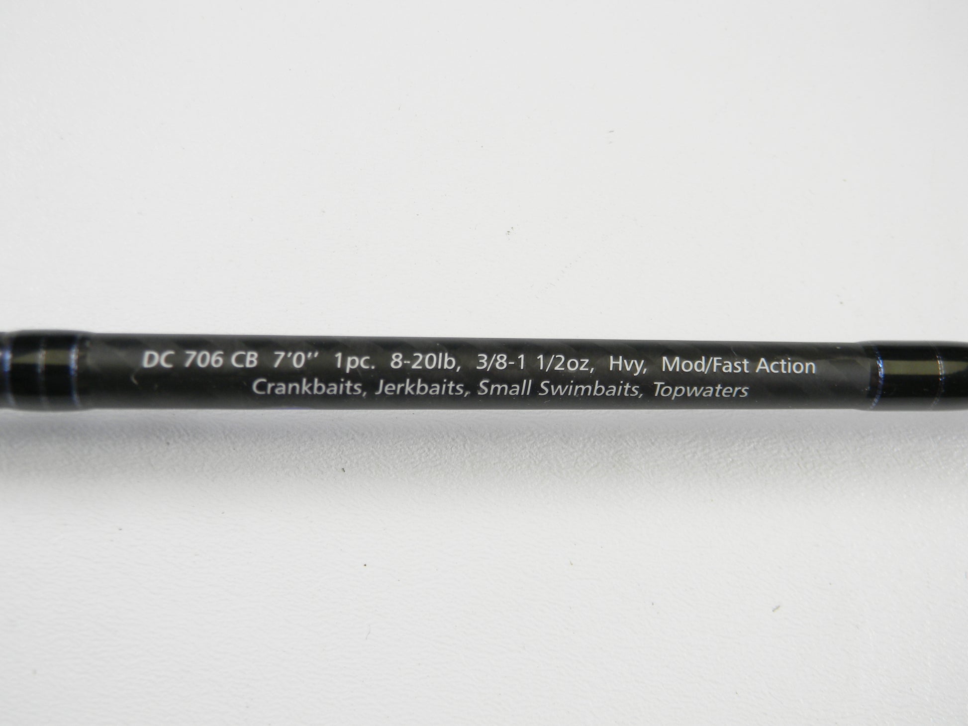 A close-up of the Dobyns Champion XP DC706CB 7'0" Heavy Used Casting Rod in excellent condition with white text showing specs. Great for Rod and Reel Trade-In or earning store credit on used Dobyns gear.