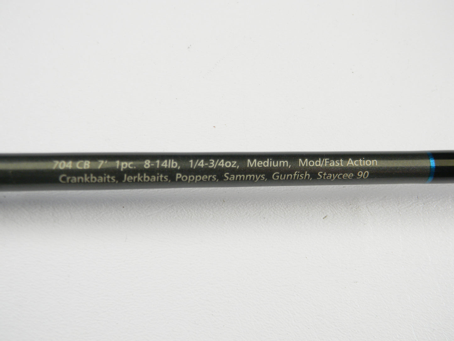 A close-up of the Dobyns Champion Gen 2 DC 704 CB 7'0" Medium Casting Rod (used, excellent condition)—1 piece, 8-14 lb, 1/4-3/4 oz, mod/fast action—ideal for crankbaits and gunfish. Upgrade via our Rod and Reel Trade-In Program!.