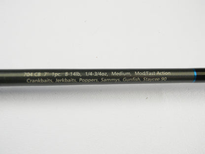 A close-up of the Dobyns Champion Gen 2 DC 704 CB 7'0" Medium Casting Rod (used, excellent condition)—1 piece, 8-14 lb, 1/4-3/4 oz, mod/fast action—ideal for crankbaits and gunfish. Upgrade via our Rod and Reel Trade-In Program!.