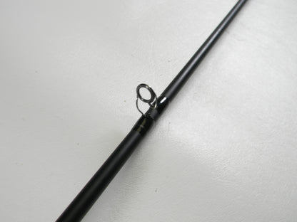 A close-up of the Dobyns Champion Gen 2 DC 704 CB 7'0" Medium Used Casting Rod in excellent condition focuses on a metal line guide, showcasing quality ideal for our Rod and Reel Trade-In Program against a white background.