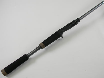 The St. Croix Black Bass RIC73MHF 7'3" Medium Heavy Used Casting Rod, in excellent condition, features a foam grip handle and trigger-style reel seat—ideal for our Rod and Reel Trade-In Program.