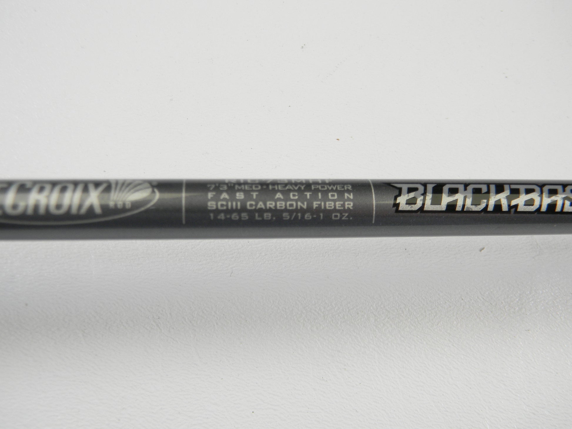 Close-up of a St. Croix Black Bass RIC73MHF 7'3" Medium Heavy Used Casting Rod—fast action, SCIII carbon fiber, 14-65 lb, 5/16-1 oz, excellent condition. Part of our Rod and Reel Trade-In Program for quality used gear seekers.
