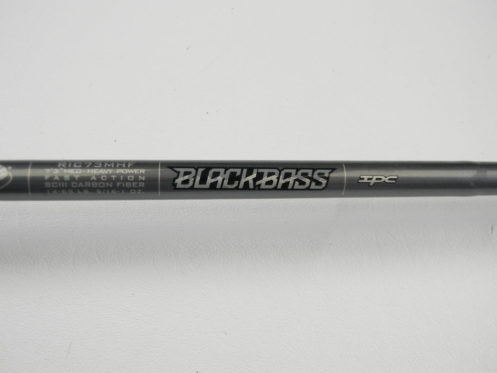 Close-up of a St. Croix Black Bass RIC73MHF 7'3" Medium Heavy Used Casting Rod in excellent condition on a white background—an ideal choice for upgrading your gear through our Rod and Reel Trade-In Program.