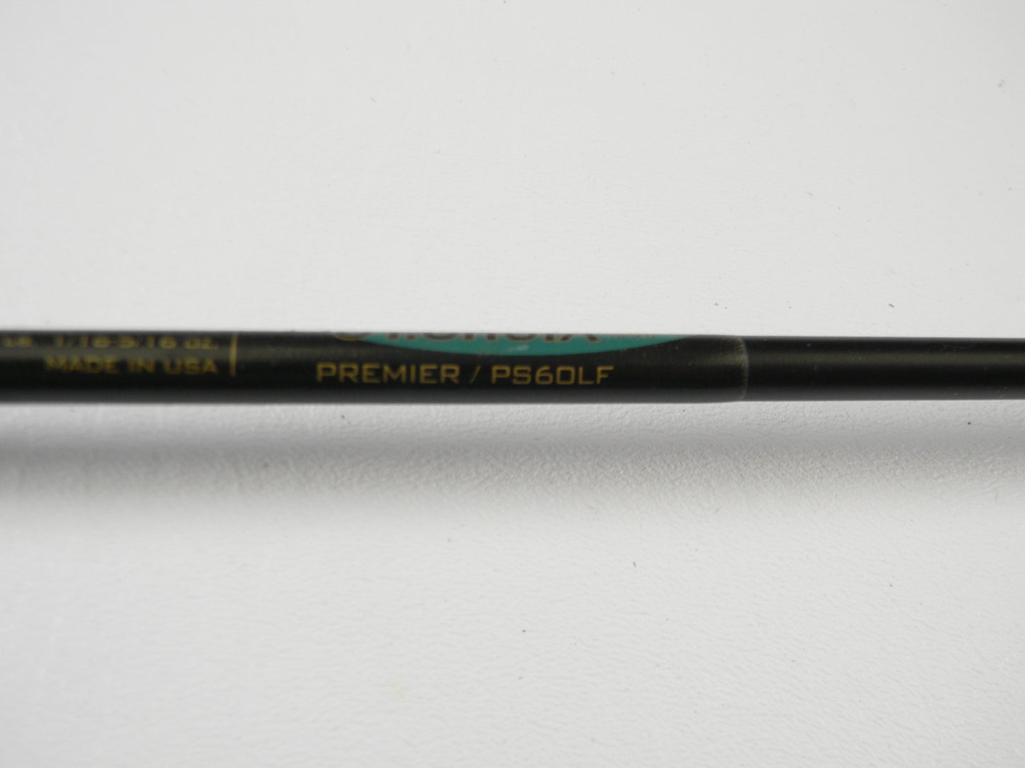 Close-up of a St. Croix Premier PS60LF 6'0" Light Used Spinning Rod in good condition, with gold branding on a black shaft, shown on a white background. Partially visible, this gear is part of our Rod and Reel Trade-In Program.