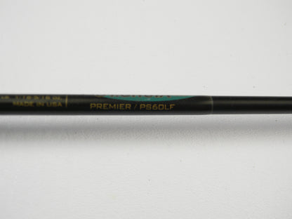 Close-up of a St. Croix Premier PS60LF 6'0" Light Used Spinning Rod in good condition, with gold branding on a black shaft, shown on a white background. Partially visible, this gear is part of our Rod and Reel Trade-In Program.