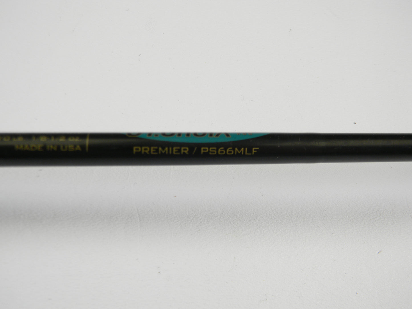 A close-up of a St. Croix Premier PS66MLF 6'6" Medium Light Spinning Rod in good used condition is featured on a white background—ideal for those considering our Rod and Reel Trade-In Program for store credit.