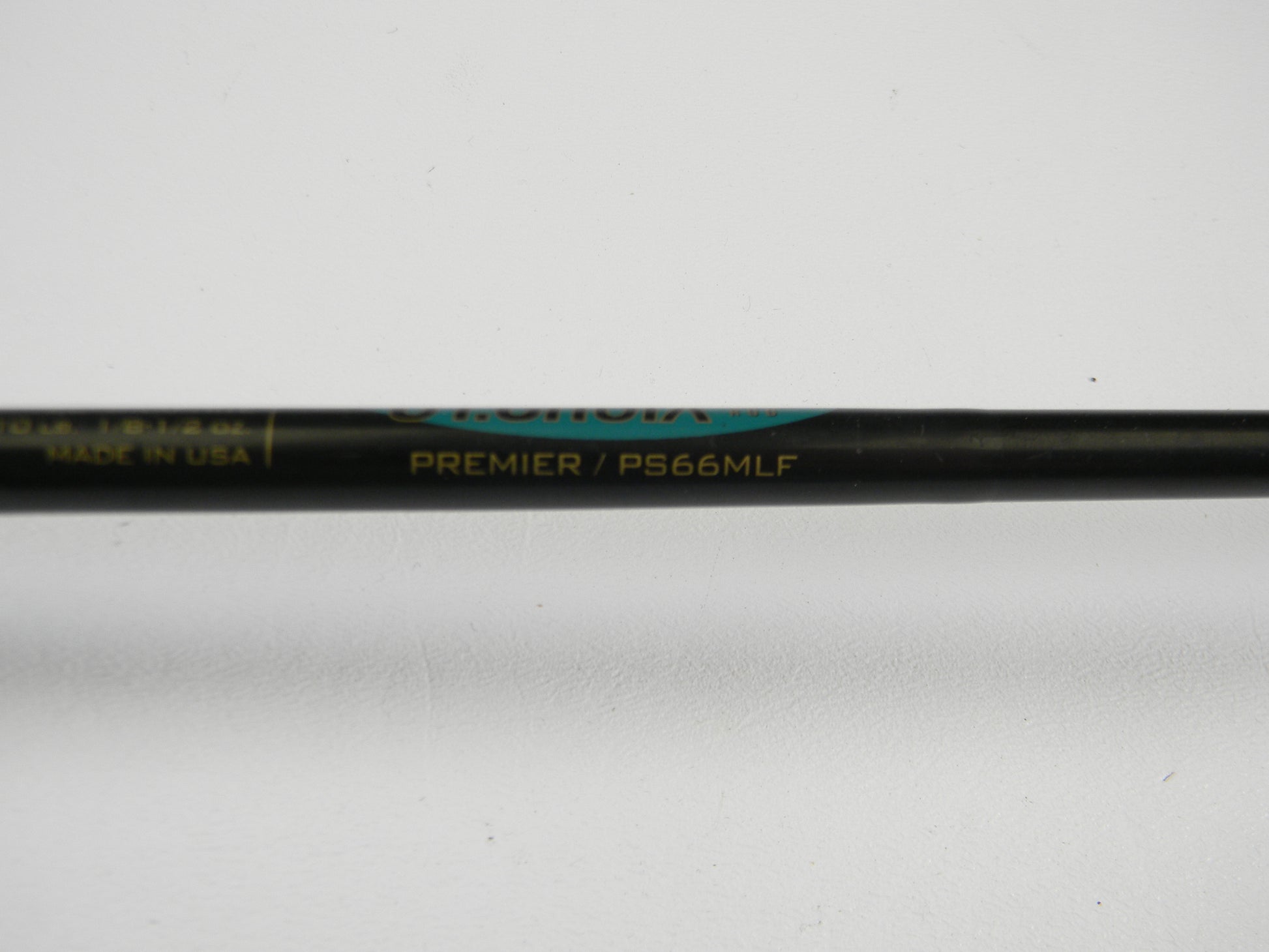 A close-up of a St. Croix Premier PS66MLF 6'6" Medium Light Spinning Rod in good used condition is featured on a white background—ideal for those considering our Rod and Reel Trade-In Program for store credit.