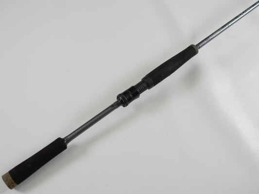 A close-up of the St. Croix Black Bass RIS73MLXF 7'3" Medium Light Used Spinning Rod in excellent condition, featuring its black handle and part of the rod, photographed on a white background—ideal for our Rod and Reel Trade-In Program.