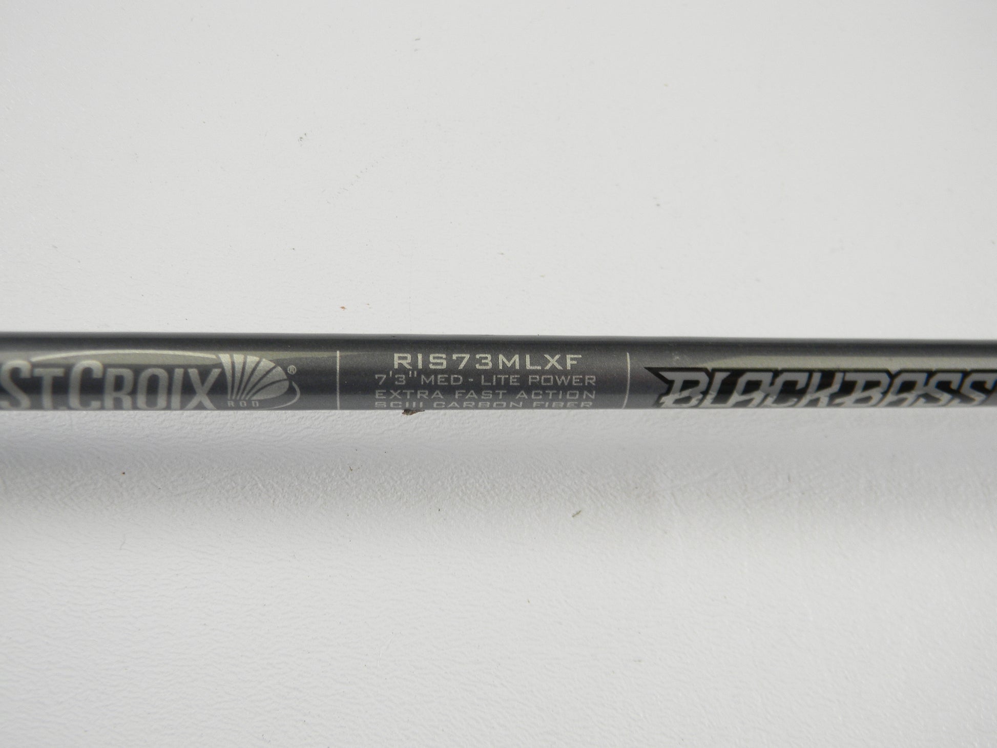 Close-up of the St. Croix Black Bass RIS73MLXF 7'3" Medium Light Used Spinning Rod label—an excellent condition option for the Rod and Reel Trade-In Program if you want quality pre-owned St. Croix gear or store credit.