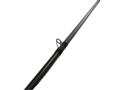 A Shimano Intenza NTZC76MHG 7'6" Medium Heavy Glass Casting Rod from our Rod and Reel Trade-In Program rests on a white surface. This black rod with red accents is in excellent used condition and may qualify you for store credit.