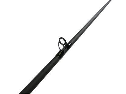 Close-up of a fishing rod guide from the St. Croix Bass X BACX68MXF 6'8" Medium - Used Casting Rod, in excellent condition. The black guide, shown on a white surface, helps hold the line and is ideal for evaluating gear for our Rod and Reel Trade-In program for store credit.
