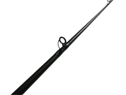 A close-up of a St. Croix Premier PC66MF casting rod in excellent condition, resting on a light surface with focus on its metallic guide ring. This black 6'6" medium rod extends diagonally, ideal for our Rod and Reel Trade-In Program for store credit on used gear.