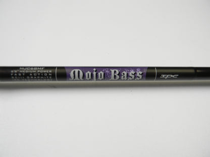 Close-up of the St. Croix Mojo Bass MJC68MF Jerkbait Casting Rod, featuring medium power, fast action, and SCIII graphite. This sleek black 6'8" rod with purple accents is part of our exclusive collection and in very good used condition.