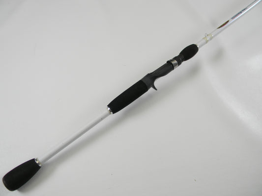 Laid diagonally on a white background, the Duckett White Ice DFWI711HC Byron Velvick 7'11" Heavy A-Rig/Swimbait used casting rod features a black handle and silver shaft. Enjoy its secure grip and metallic accents for your next catch. Trade it in through our Rod and Reel Trade-In Program for store credit.