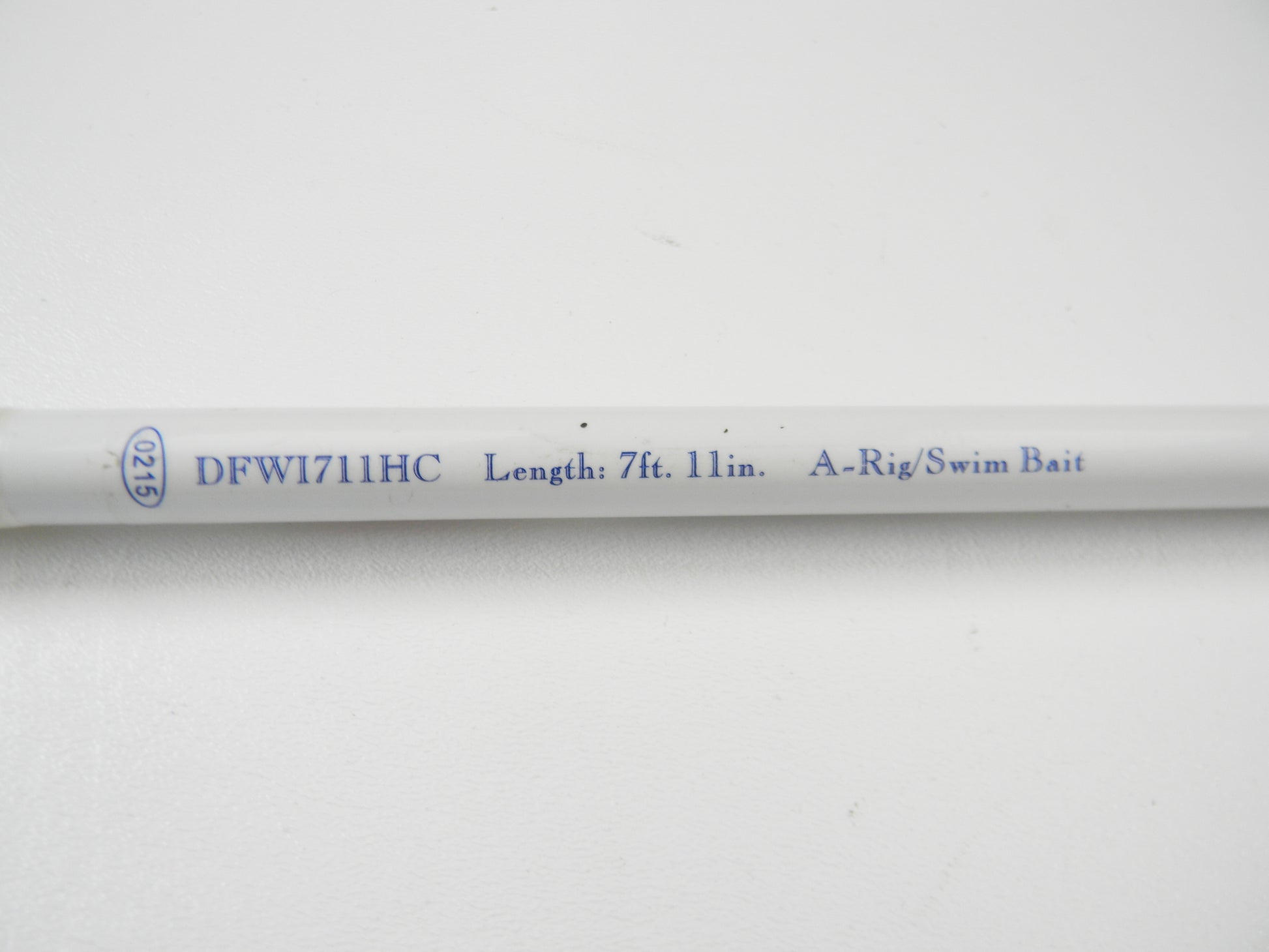 A close-up of the 7'11" Duckett White Ice DFWI711HC Byron Velvick rod, ideal for A-Rig/Swimbait. The "00715" indicates it's used. Trade it in through the Nation's Best Rod and Reel Trade-In Program for store credit.