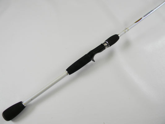 The Duckett White Ice DFWI711MHCC Byron Velvick 7'11" Medium Heavy Lure Launcher, a used casting rod in very good condition with a white shaft and black handle, is perfect for quality gear seekers. Consider our rod and reel trade-in options to upgrade or earn store credit.
