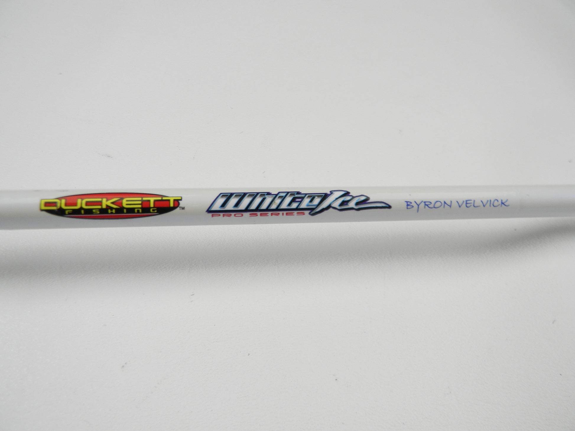 Close-up of a Duckett White Ice DFWI711MHCC Byron Velvick 7'11" Medium Heavy Lure Launcher, a used casting rod in very good condition, ideal for upgrading gear with a Rod and Reel Trade-In deal.