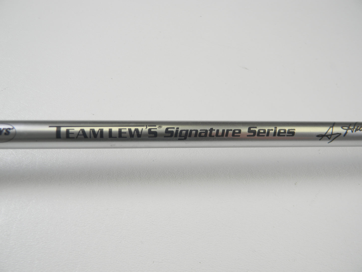 A close-up of the Lew's Signature Series TLS76H Pitching 7'6" Heavy rod in excellent condition reveals its polished finish against a plain white background. Discover great used gear with our Rod and Reel Trade-In Program for potential store credit.