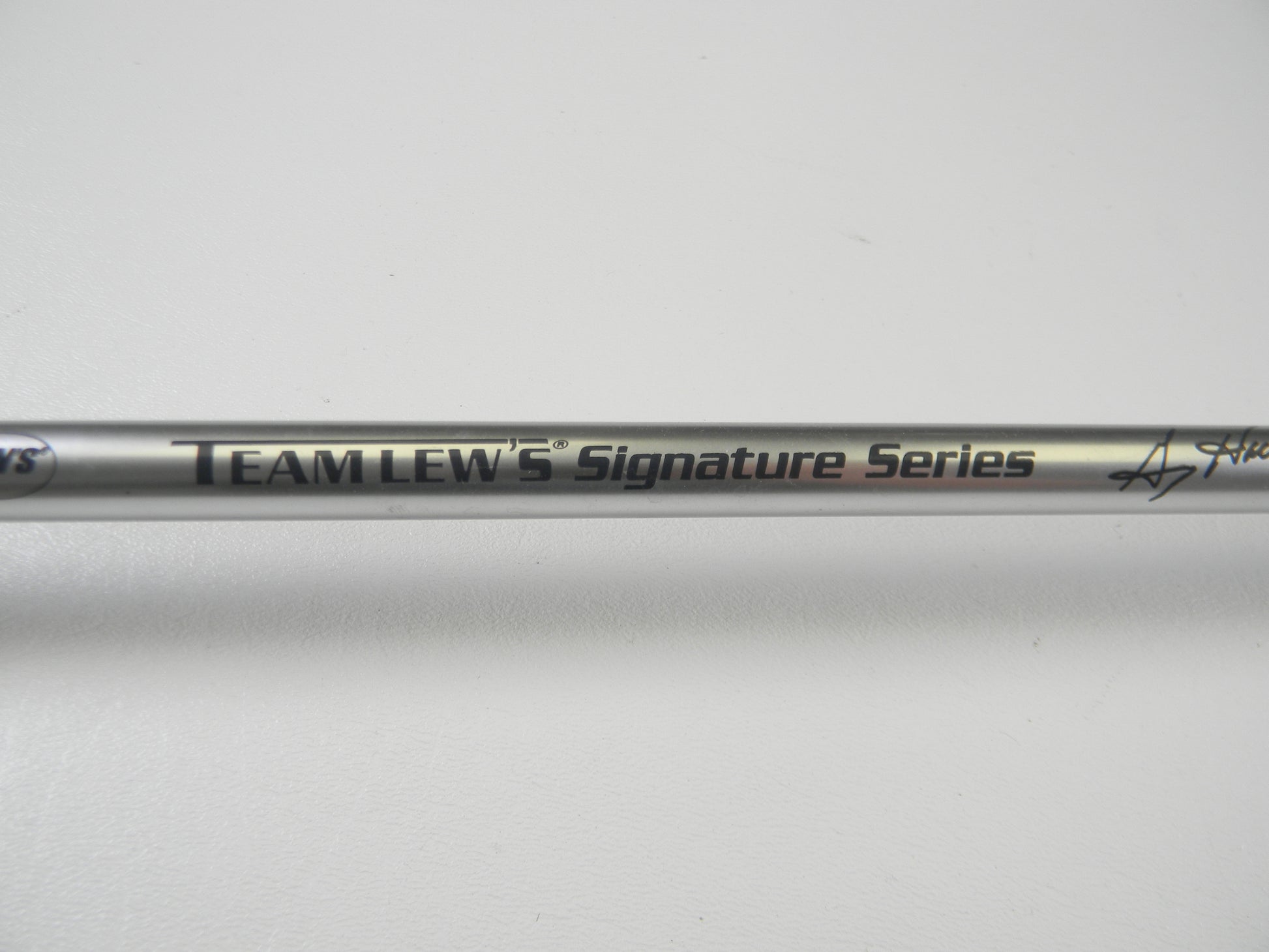 A close-up of the Lew's Signature Series TLS76H Pitching 7'6" Heavy rod in excellent condition reveals its polished finish against a plain white background. Discover great used gear with our Rod and Reel Trade-In Program for potential store credit.