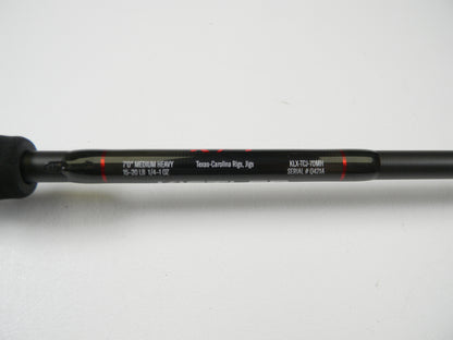 Close-up of a Lew's Kistler KLX KLX-TCJ-70MH casting rod in excellent condition shows "7'0” Medium Heavy," supports "15-20 lb" and "1/4-1 oz," good for Texas-Carolina Rigs and Jigs. Visible model number is “KLX-TC3-70MH” with serial "#04214." Ideal for trading up through our Rod and Reel Trade-In Program.