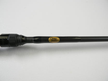 Close-up of a black fishing rod with a glossy finish, labeled "Cashion" in gold and black. Ideal for trading in used gear at select stores for credit. The sleek Cashion P84469b 6'9" Medium Heavy casting rod is displayed elegantly on a white background, showcasing its good condition.