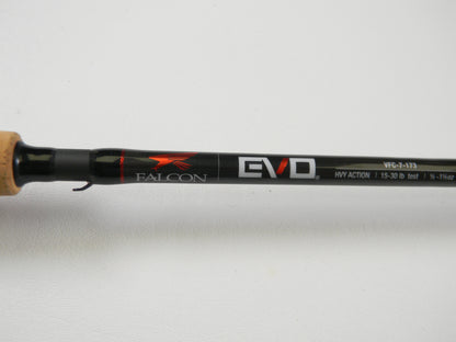 Close-up of the Falcon EVO VFC-7-173 7'3" Heavy casting rod with "HVY ACTION" and line weight details. It features a cork grip and sleek black finish, ideal for upgrading anglers. Qualifies for Rod and Reel Trade-In Program to earn store credit on used gear.