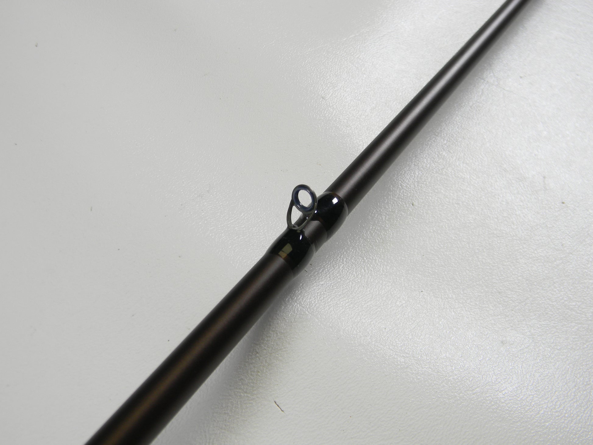Close-up of a Falcon Lowrider LFC-72HH Flippin Stik 7'2" Heavy casting rod section on a white background, featuring a black guide ring. Ideal for the Rod and Reel Trade-In Program, where used gear like this earns you store credit for your next adventure.