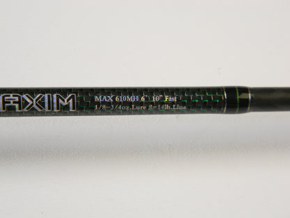 Close-up of a Phenix Maxim PHX-MAX-C610MH 6'10" Medium Heavy casting rod with "MAX 610MH 6'10" Fast 1/8 - 3/4oz. Lure 6 - 14lb. Line" in green and white, featuring "AXIM" prominently. Ideal for our Rod and Reel Trade-In Program—upgrade your used gear for store credit today!.