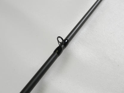 A close-up of the Dobyns Fury FR734C 7'3" Heavy casting rod against a white background highlights the intricate detail of one guide, featuring a black ring and mounting. Upgrade with our Rod and Reel Trade-In Program to earn store credit for your used gear.