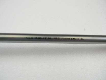 A close-up of the Daiwa Tatula Elite TAEL691MLRB 6'9" ML Used Casting Rod in mint condition, showing “LURE: 1/4–5/8oz LINE: 8–14lb” on its shaft—great for a Rod and Reel Trade-In or adding quality used gear.