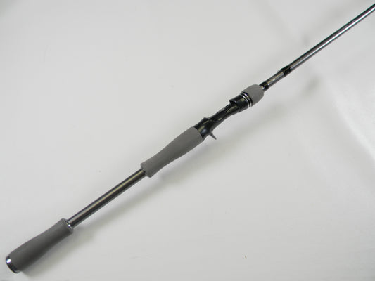 A close-up of a Daiwa Tatula Elite AGS TTEL761HFB-AGS 7'6" Heavy Used Casting Rod in mint condition, diagonally placed on a white background—perfect for the Nation's Best Rod and Reel Trade-In Program.
