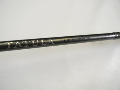 Close-up of a Daiwa rod displaying "Tatula" in large letters. Additional text reads "ELITE 7'5'' FLIPPIN' SHAUN KGS" against a plain white background. Explore our Trade-In program for store credit to upgrade your used gear.