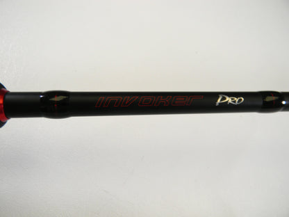 Close-up of a black Ark Fishing rod, model Invoker Pro IVP71MXS 7'1" Medium, with red and white lettering on a white background. Upgrade now with our Rod and Reel Trade-In Program to convert used gear into valuable store credit.