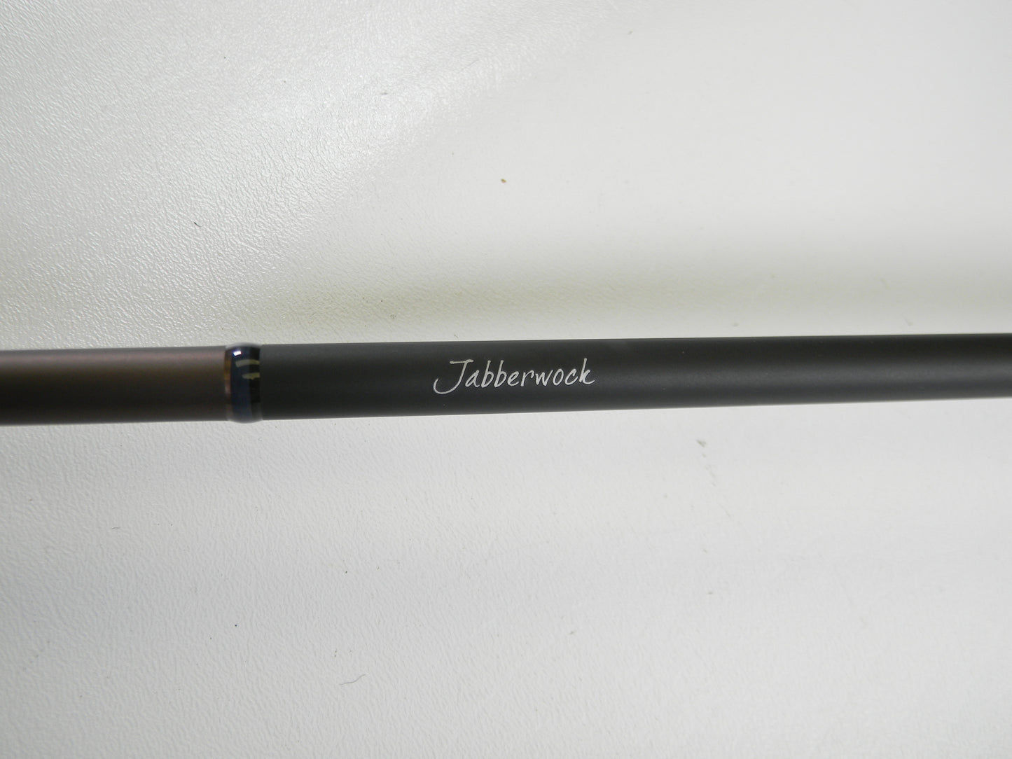 A Megabass Orochi X10 F4-68XT Jabberwock 6'8" Medium Light used casting rod in excellent condition, black with "Jabberwock" in white script, shown on a plain white background—eligible for our Rod and Reel Trade-In Program.