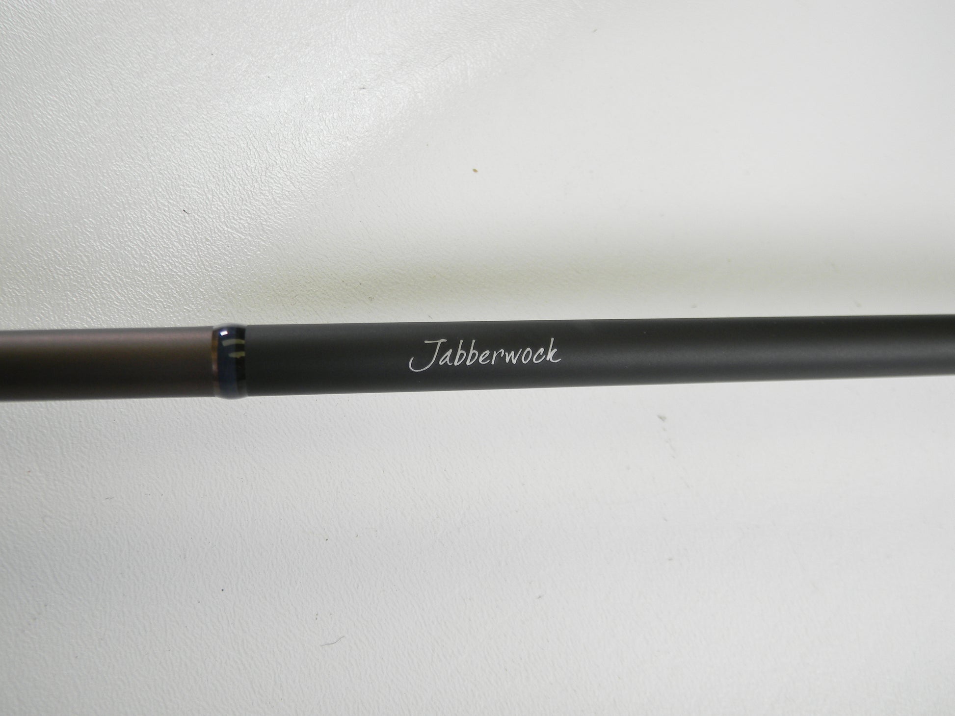 A Megabass Orochi X10 F4-68XT Jabberwock 6'8" Medium Light used casting rod in excellent condition, black with "Jabberwock" in white script, shown on a plain white background—eligible for our Rod and Reel Trade-In Program.