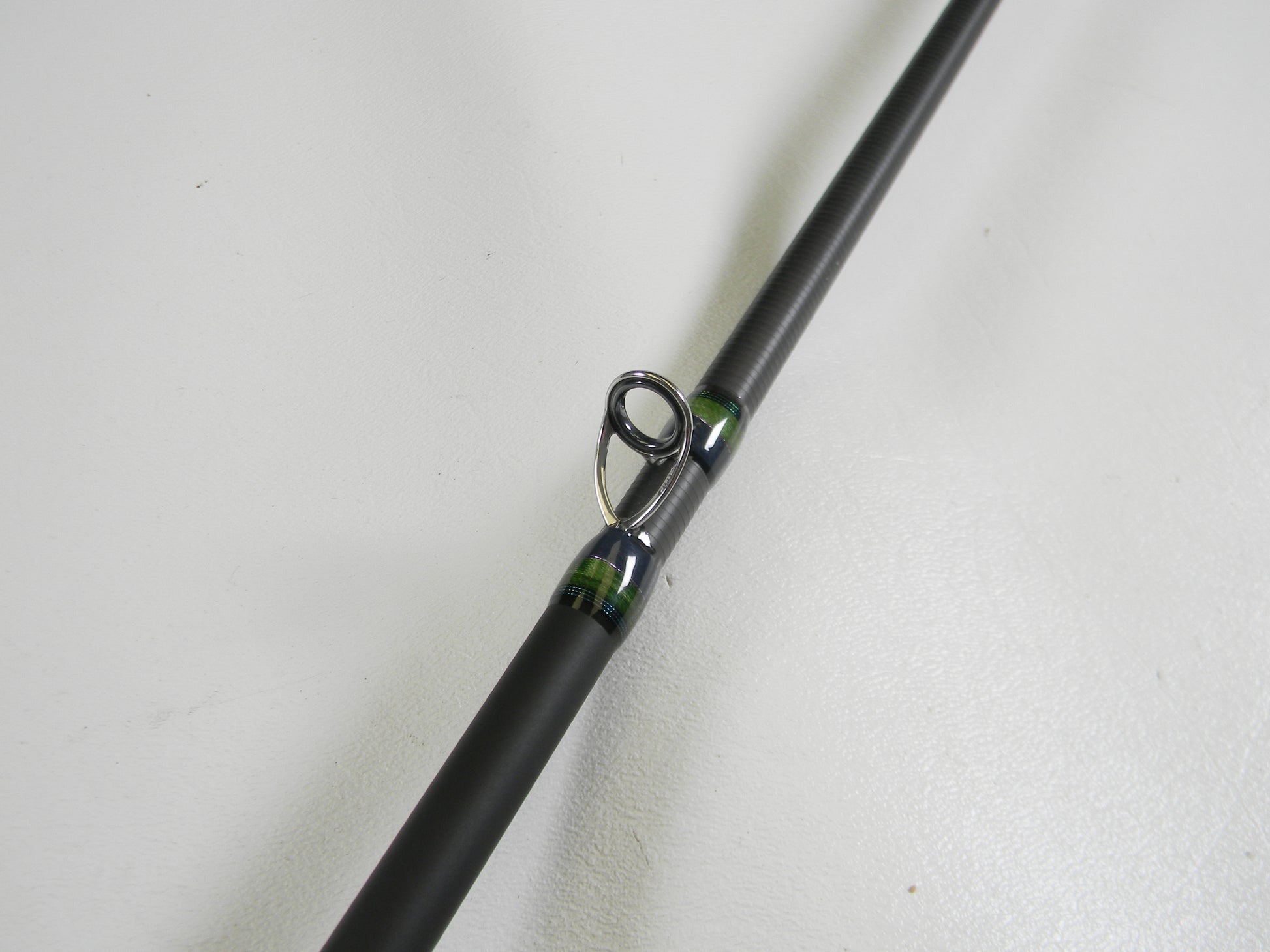 A close-up of a Megabass Orochi X10 F4-68XT Jabberwock 6'8" Medium Light Used Casting Rod in excellent condition, ideal for those looking to upgrade gear through the Rod and Reel Trade-In Program for store credit.
