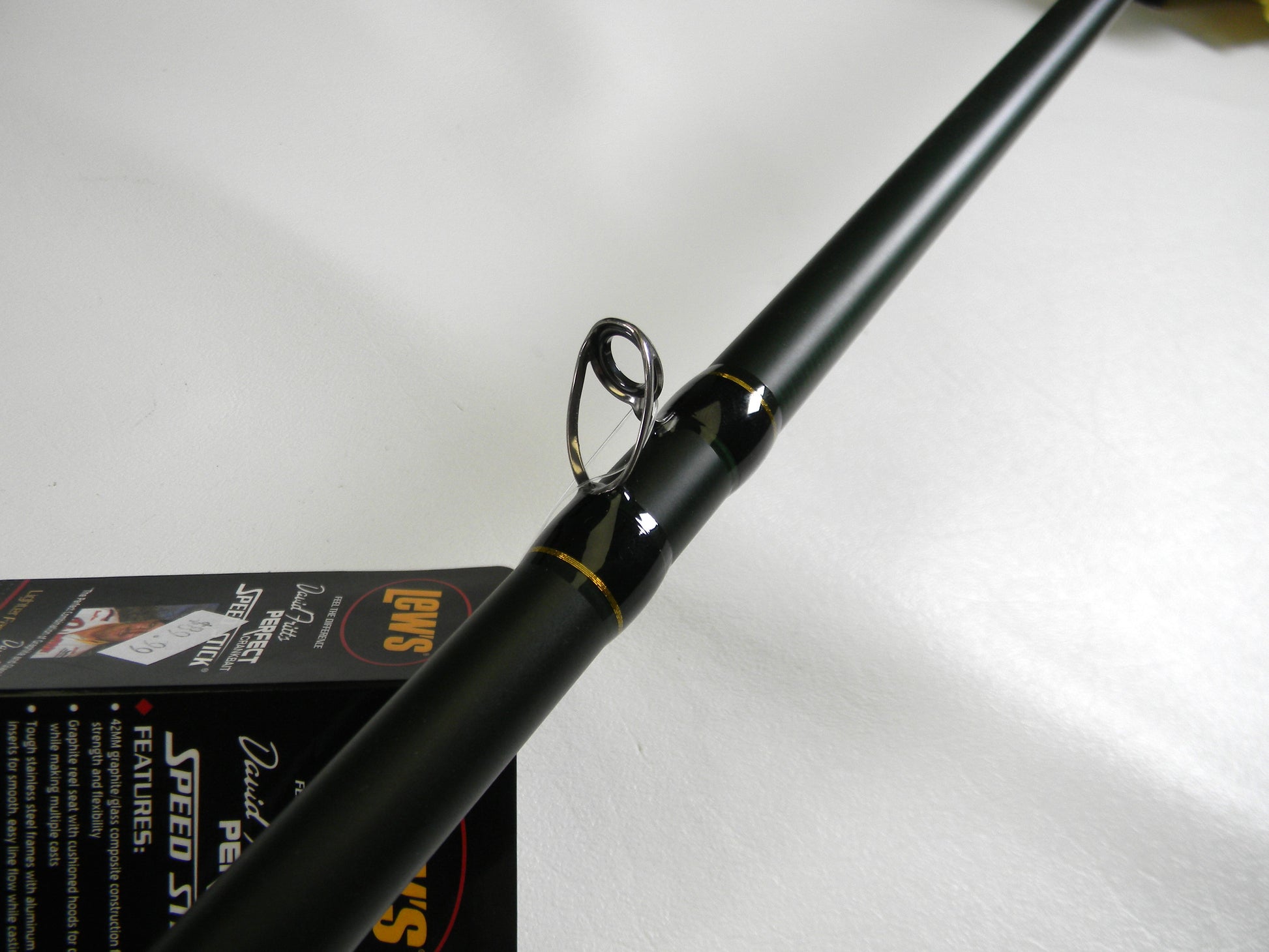Close-up of a Lew's David Fitts Perfect Crankbait LDFP76MH black casting rod, with a silver guide loop on a white background. Partially visible label suggests history, perfect for those seeking used gear and store credit through the Rod and Reel Trade-In program. Mint condition, 7'6" medium heavy.