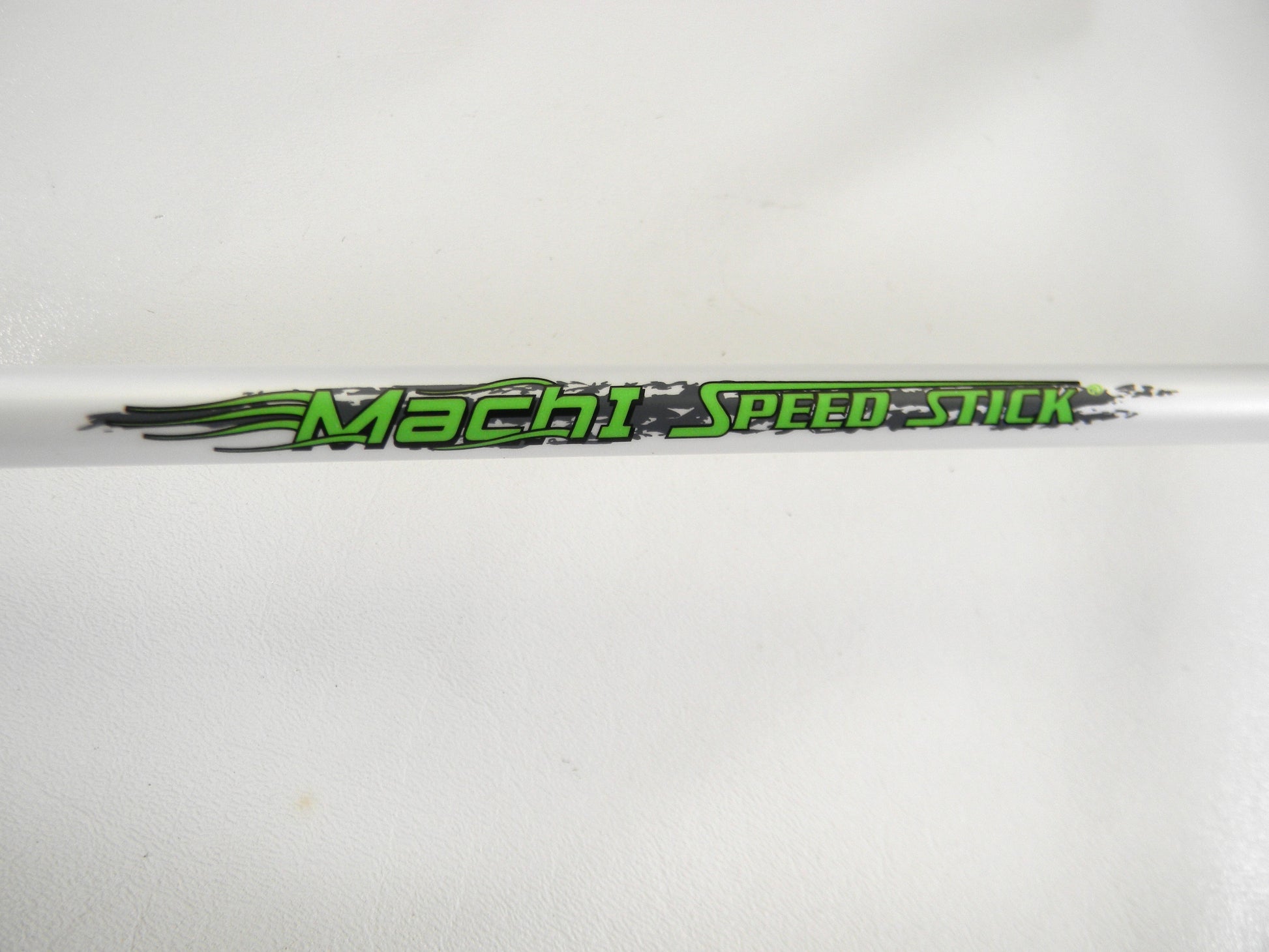 Close-up of a white Lew's rod featuring green and black text "Mach SPEED-STICK" with flame graphics, part of Rod and Reel Trade-In Program offering store credit for used gear. Product: Mach 1 MH1SHA610MH 6'10" Medium Heavy Used Casting Rod in Mint Condition.