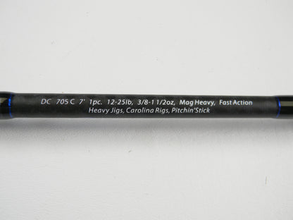 A close-up of the Dobyns Champion XP DC705C 7'0" Mag Heavy Used Casting Rod in excellent condition, with specs in white on a black rod—ideal for anglers using our Rod and Reel Trade-In Program or upgrading for store credit.