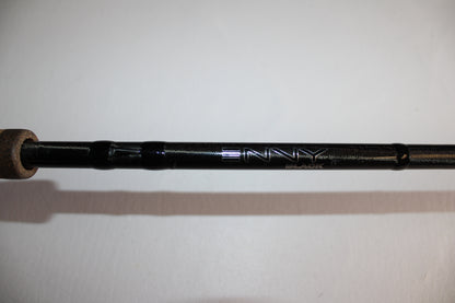 Close-up of a 13 Fishing Envy Black EB3C79C Crank Used Casting Rod in good condition, featuring "ENVY" and "BLACK" in silver lettering on its black body. The background is plain white.