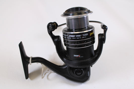 A close-up of a black and silver Lew's Tournament Speed Spin TS3000H 6.1:1 used spinning reel in very good condition against a plain white background. Ideal for upgrading or earning store credit through our Rod and Reel Trade-In Program.
