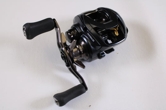 A close-up of the Daiwa Steez A 100 STZ100XH 8.5:1 RH used casting reel in very good condition—ideal for upgrading with our Rod and Reel Trade-In Program or earning store credit for your used Daiwa gear.