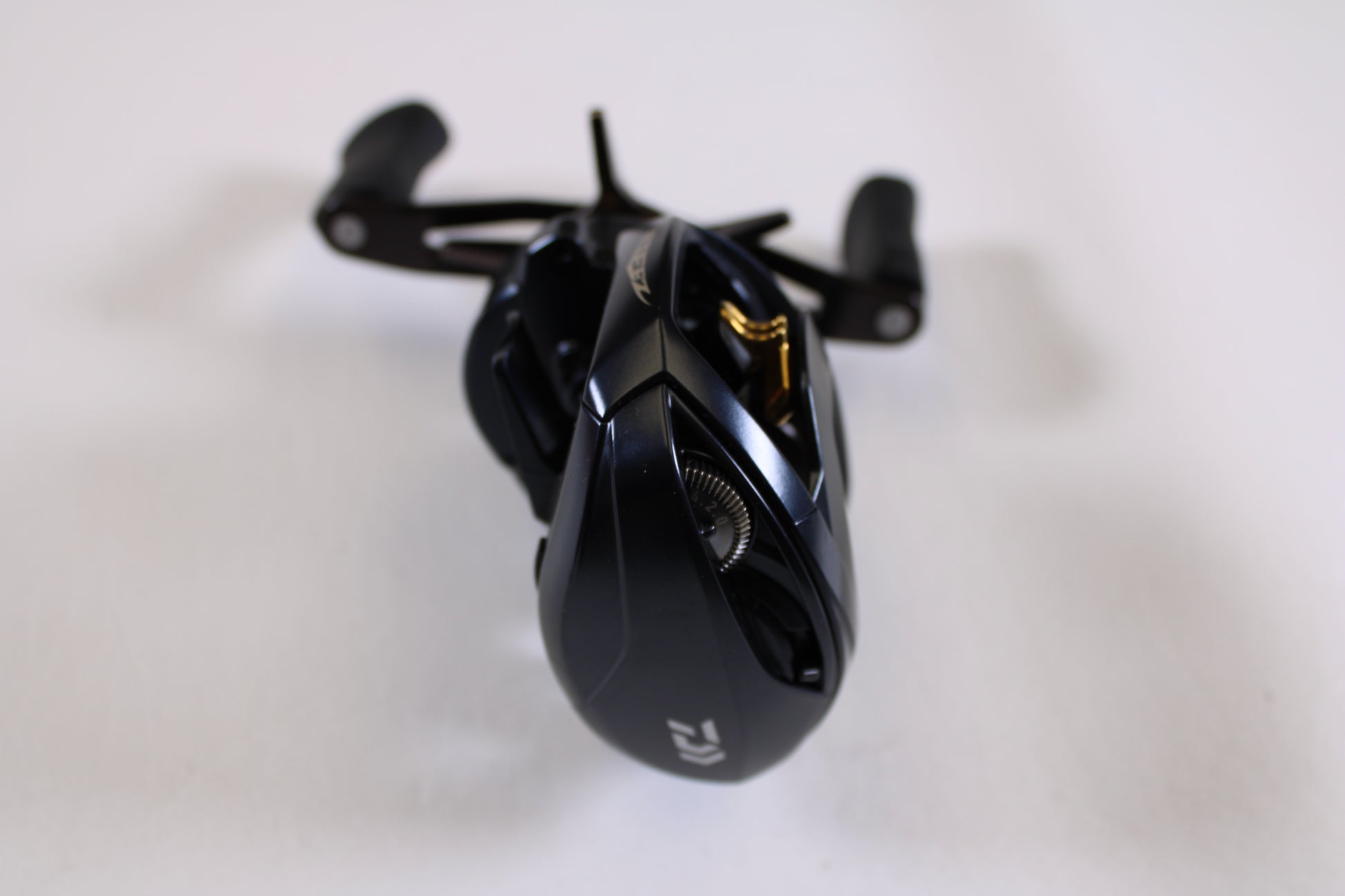 A close-up of a Daiwa Steez A 100 STZ100XH 8.5:1 RH Used Casting Reel in very good condition—ideal for anglers interested in used gear or our Rod and Reel Trade-In Program to earn store credit.