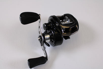 A close-up of the Abu Garcia Revo Winch Gen 2 5.4:1 RH Used Casting Reel in excellent condition, featuring padded handles against a white background—ideal for those exploring our Rod and Reel Trade-In Program or quality pre-owned gear.