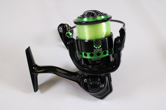 A Dobyns Maverick Green MV2000GRNSPIN 5.2:1 used spinning reel in excellent condition, featuring a black and bright green design—ideal for your next rod and reel trade-in or to enhance your used gear collection.