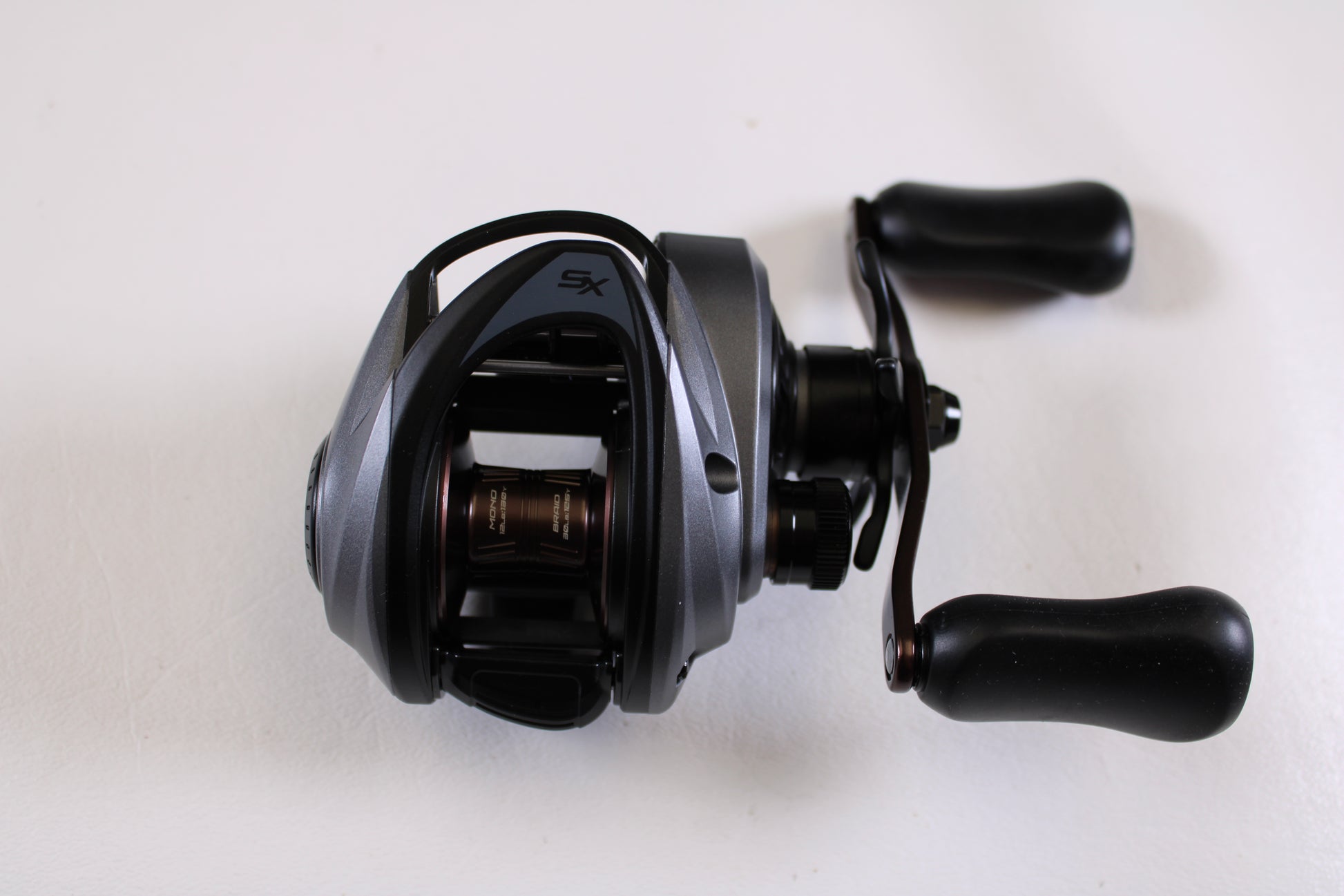 A detailed view of the Abu Garcia Revo SX REVO5 SX LP 6.7:1 RH Used Casting Reel in excellent condition—ideal for upgrading through our Rod and Reel Trade-In Program for store credit.
